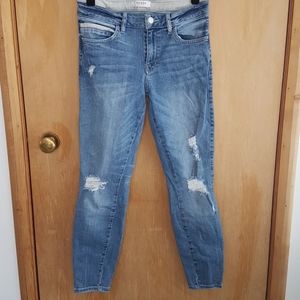 Medium wash jean with light distressing.